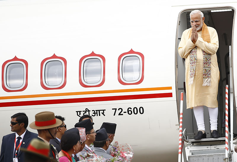Indian Prime Minister Narendra Modi gestures upon his arrival at Tribhuvan International Airport in Kathmandu, Nepa,l on Friday, May 11, 2018. Photo: Skanda Gautam