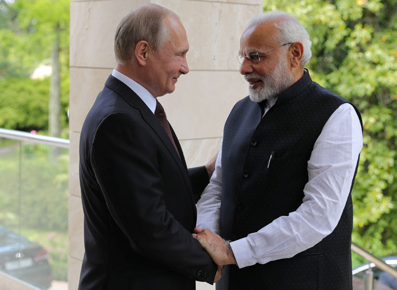  FILE: Russian President Vladimir Putin welcomes Indian Prime Minister Narendra Modi during their meeting, in the Black Sea resort of Sochi, Russia, on May 21, 2018. Photo: Reuters