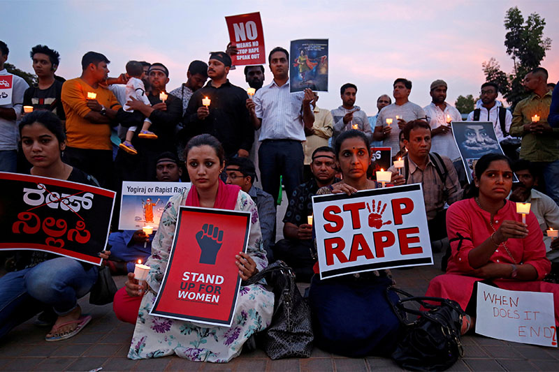 FILE PHOTO: People participate in a candle light vigil as they protest against the rape of an eight-year-old girl in Kathua near Jammu, and a teenager in Unnao, Uttar Pradesh state, in Bengaluru, India, April 13, 2018. Photo: Reuters