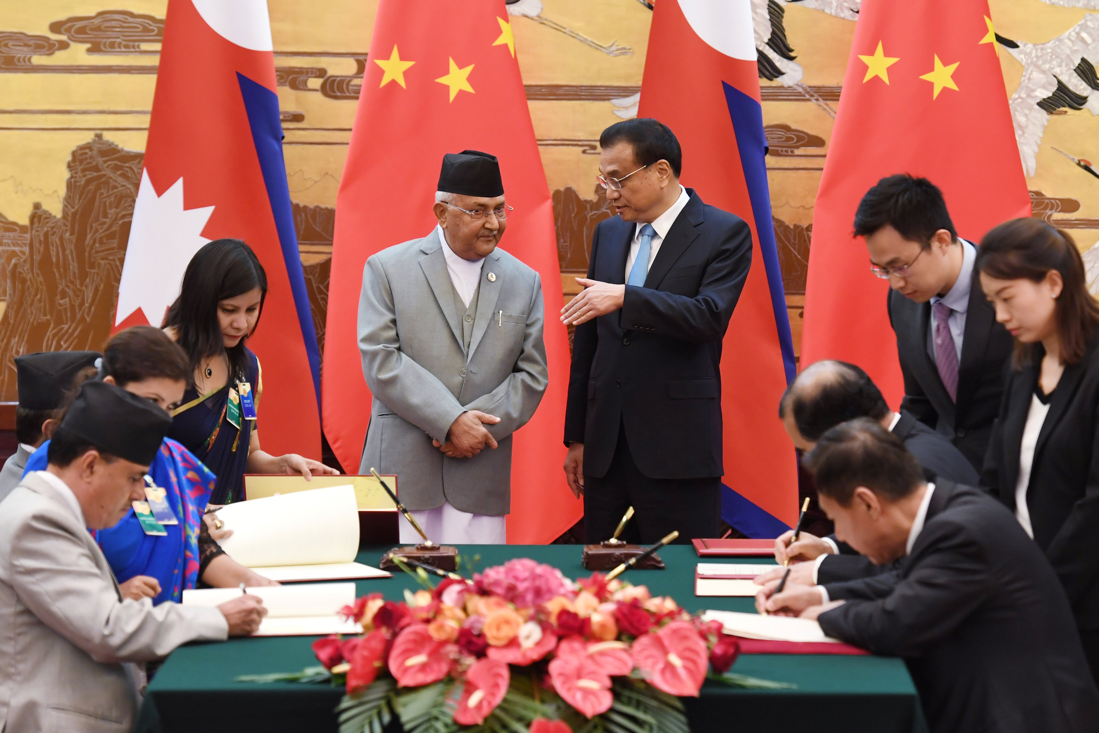 Nepal's Prime Minister KP Sharma Oli and Chinese Premier Li Keqiang speak during a signing ceremony at the Great Hall of the People in Beijing, China, on June 21, 2018. Photo: REUTERS