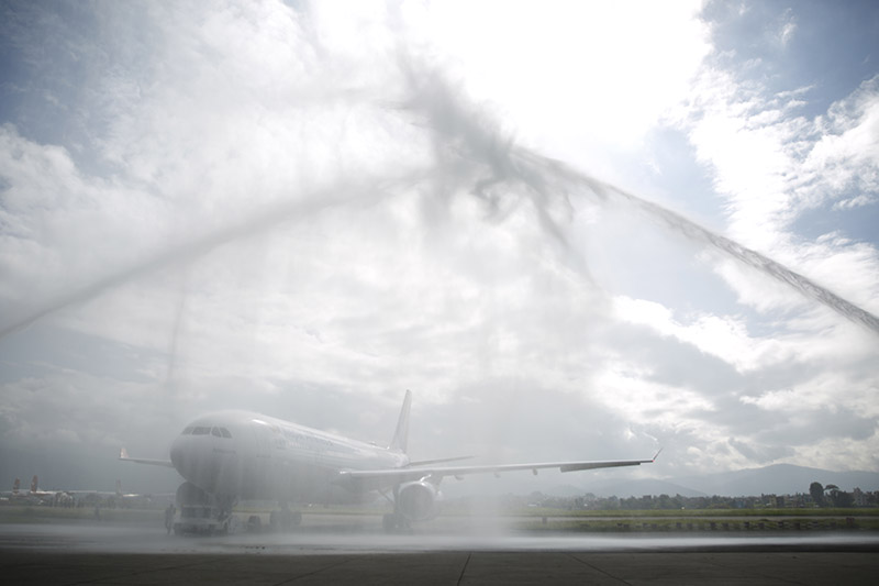 A new first long-range Airbus A330-200 aircraft of Nepal Airlines Corporation is welcomed in a traditional water cannon salute at Tribhuvan International Airport in Kathmandu, on Thursday, June 28, 2018. Rolls-Royce Trent 700 engines power the new aircraft. Photo: Skanda Gautam