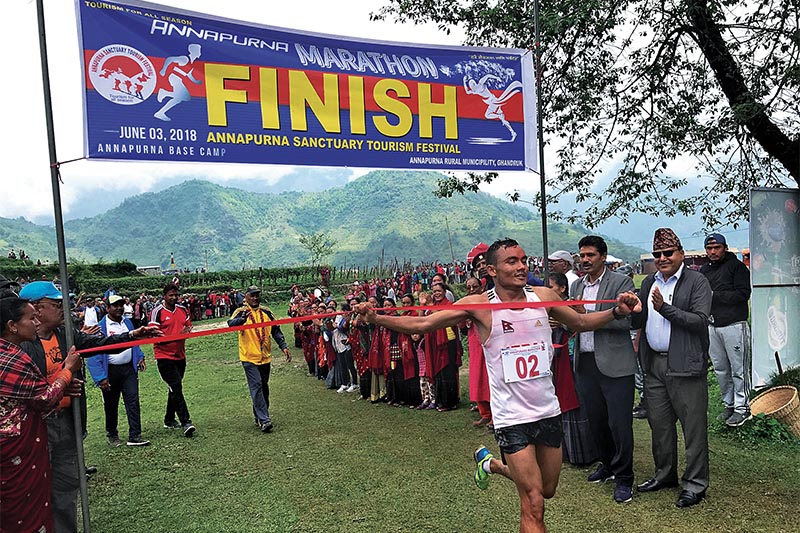 Tribhuvan Army Club athlete and Olympian Hari Kumar Rimalcrosses the finish line to win the Annapurna Marathon in Pokhara on Sunday. Photo: THT