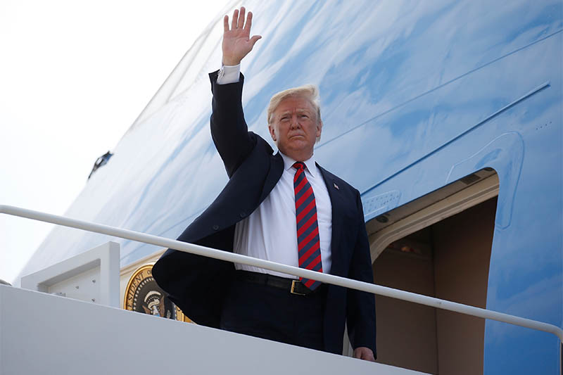 US President Donald Trump waves as he boards Air Force One to depart for travel to Canada from Joint Base Andrews in Maryland, US, June 8, 2018. Photo: Reuters