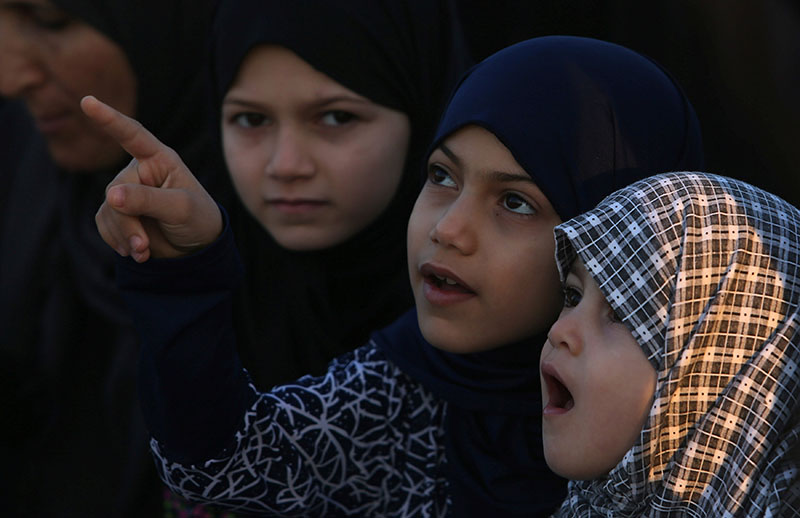 Palestinian girls attend Eid al-Fitr prayers in Khan Younis in the southern Gaza Strip, on June 15, 2018. Photo: Reuters