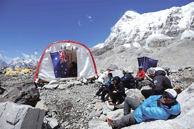 Patients waiting to see a doctor outside the Everest emergency room tent clinic at Everest Base Camp, some 140km northeast of Kathmandu, on April 24, 2018. Established by an American doctor and now run by the Nepal-based Himalayan Rescue Association, the Everest ER charges foreign climbers for treatment and in return provides subsidised care to the Sherpas. Photo: AFP
