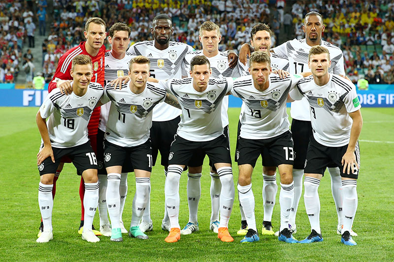 Germany players pose for a team group photo before the match. Photo: Reuters