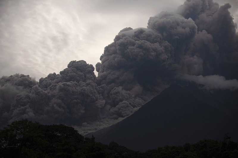 Volcan de Fuego, or Volcano of Fire, blows outs a thick cloud of ash, as seen from Alotenango, Guatemala, Sunday, June 3, 2018. One of Central America's most active volcanos erupted in fiery explosions of ash and molten rock Sunday, killing people and injuring many others while a towering cloud of smoke blanketed nearby villages in heavy ash. Photo: AP