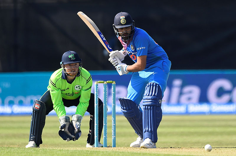 India's Sharma Rohit in action as Ireland's Stuart Poynter looks on during First International T20 match between Ireland and India, at The Village, in Malahide, Ireland, on June 27, 2018. Photo: Reuters