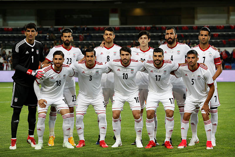Iran players pose for a team group photo before the match. Photo: Reuters