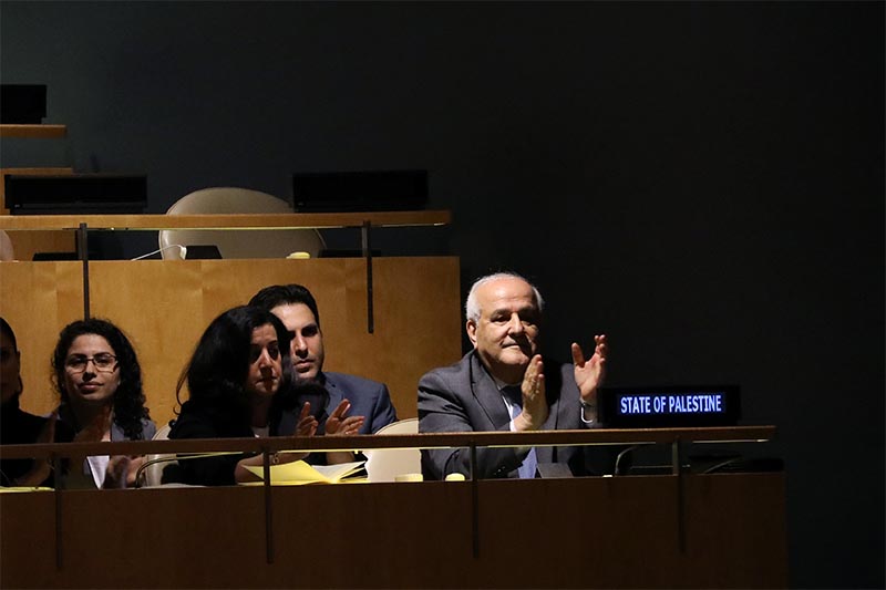 Palestinian Ambassador to the United Nations Riyad Mansour applauds following the adoption of a draft resolution by the United Nations General Assembly to deplore the use of excessive force by Israeli troops against Palestinian civilians at UN headquarters in New York, US, on June 13, 2018.  Photo: Reuters