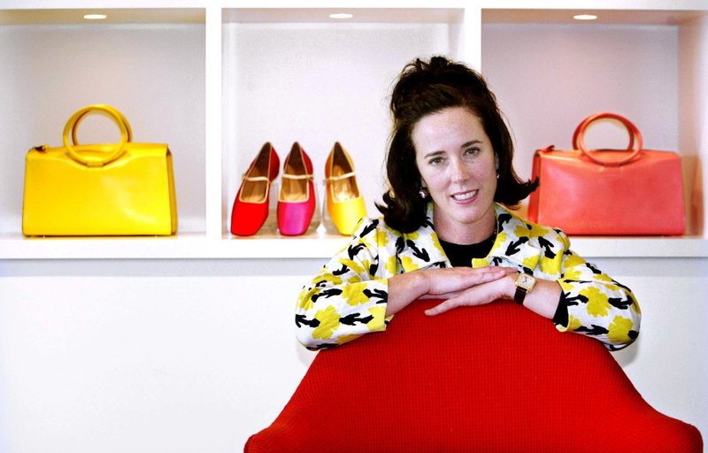 File - In this photo, designer Kate Spade poses with handbags and shoes from her next collection in New York on May 13, 2004. Photo: AP