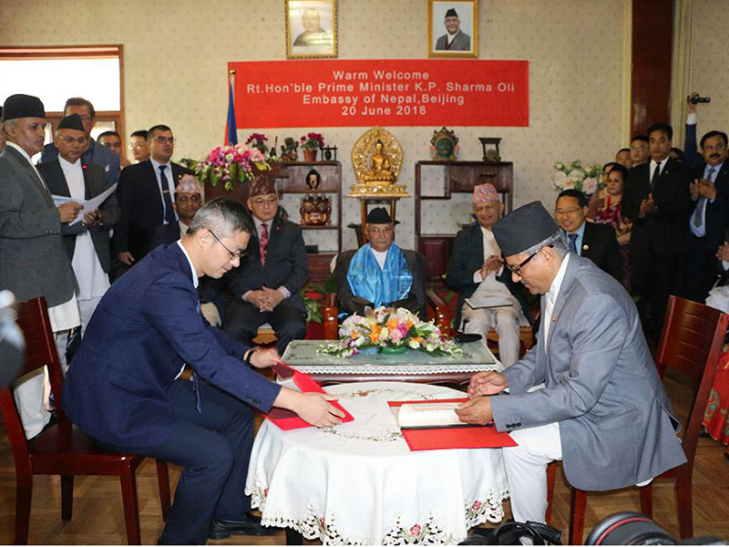 Chief Executive Officer (CEO) of Investment Board Maha Prasad Adhikari and Vice President of Huaxin Cement  Xu Gang signing the project investment agreement between the Investment Board of Government of Nepal and Huaxin Cement, in Beijing, China, on Wednesday, June 20, 2018. Photo: RSS