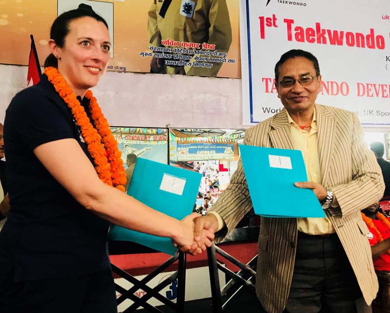 NTA President Prakash Shumsher Rana and Catherine Sweet of UK Sports exchanging the MoU in Kathmandu.