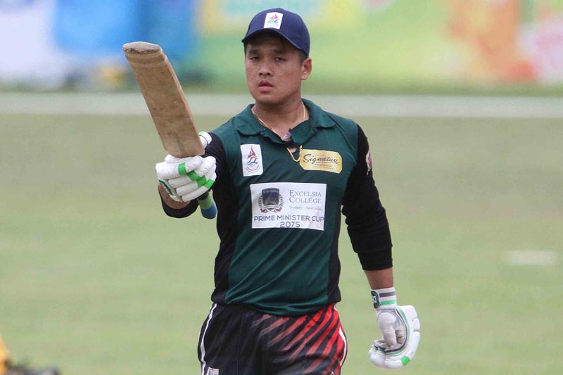 Sagar Pun of Tribhuvan Army Club raises his bat to celebrate a century against Province No.5 in semi-final match during their PM Cup Cricket Tournament at TU Cricket Stadium in Kathmandu on Friday, June 8, 2018. Photo: THT