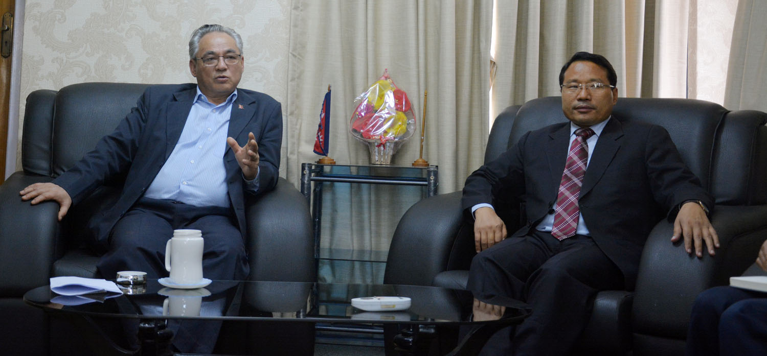 Home Minister Ram Bahadur Thapa and Energy Minister Barsha Man Pun holding a meeting, on Wednesday, June 13, 2018. Photo: RSS