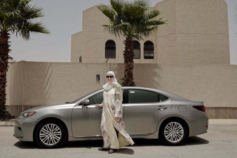 In this photo, Ammal Farahat, who has signed up to be a driver for Careem, a regional ride-hailing service that is a competitor to Uber, poses for a photograph next to her car on a street in Riyadh, Saudi Arabia on Sunday, June 24, 2018 . Photo: AP
