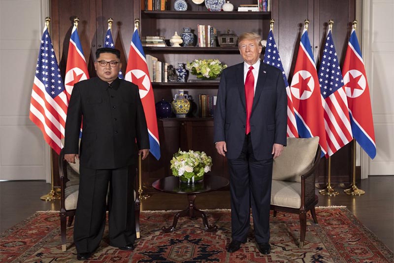 North Korea leader Kim Jong Un (left) with US President Donald Trump's hand at the Capella resort on Sentosa Island,  in Singapore, on Tuesday, June 12, 2018. Photo courtesy: Dan Scavino Jr