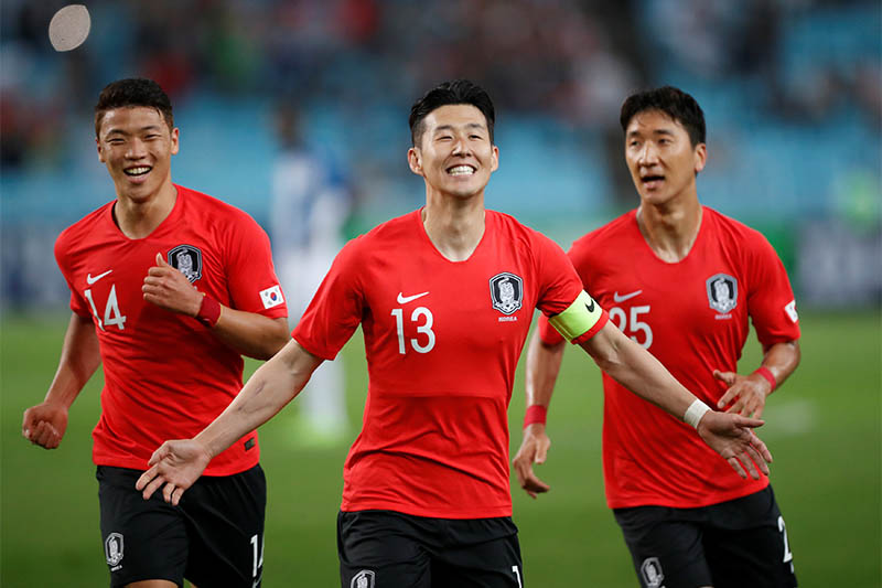 South Korea's Son Heung-Min celebrates scoring their first goal with team mates. Photo: Reuters