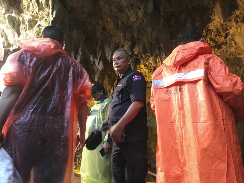 Rescue workers gather at the entrance of a cave in Mae Sai, Chiang Rai province, northern Thailand, on Wednesday, June 27, 2018. Photo: AP