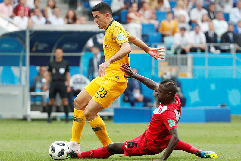 Australia's Tom Rogic in action with Peru's Christian Ramos. Photo: Reuters