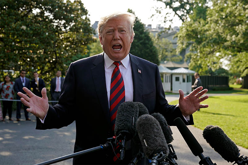 US President Donald Trump speaks as he departs the White House in Washington, US, on his way to the G7 Summit in Canada, June 8, 2018. Photo: Reuters