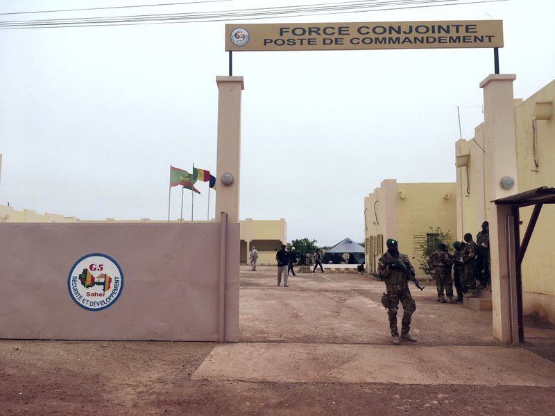 In this photo, a member of the army stands guards at the entrance of the headquarters of a new, five-nation West African counterterror force, in Mali on Wednesday, May 30, 2018. Photo: AP