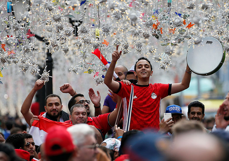 Supporters of the Egyptian national soccer team cheer during a gathering near Red Square on the eve of the 2018 FIFA World Cup, in central Moscow, Russia, on June 13, 2018. Photo: Reuters