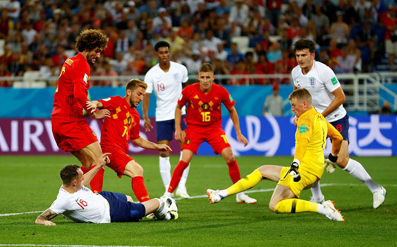 Belgium's Marouane Fellaini and Dries Mertens in action with England's Phil Jones and Jordan Pickford during World Cup Group G match between England and Belgium, at Kaliningrad Stadium, in Kaliningrad, Russia, on June 28, 2018. Photo: Reuters.