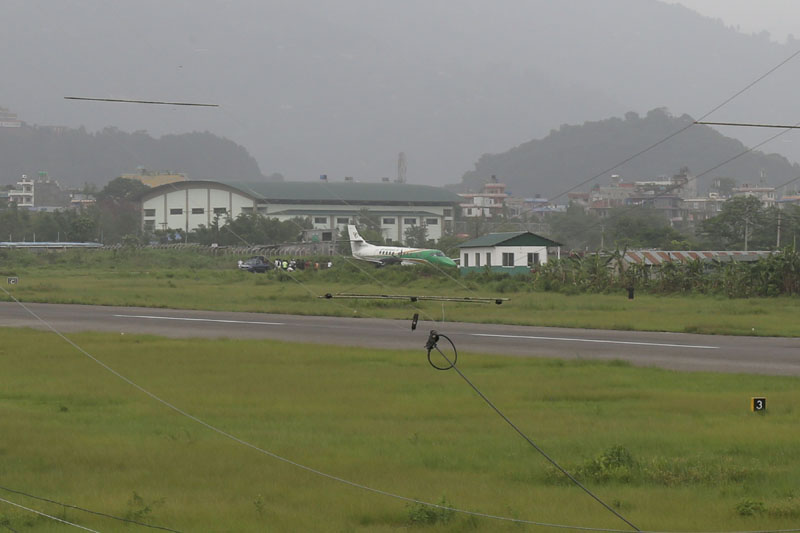 Stakeholders seen near an aircraft of Yeti Airlines which veered off the runway at Pokhara airport after facing a glitch in hydraulic systems on Sunday, June 17, 2018. Photo: RSS