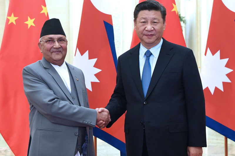 Prime Minister KP Sharma Oli shakes hand with Chinese President Chinese President Xi Jinping during a meeting in Beijing on Wednesday, June 20, 2018. Photo courtesy: Xinhua