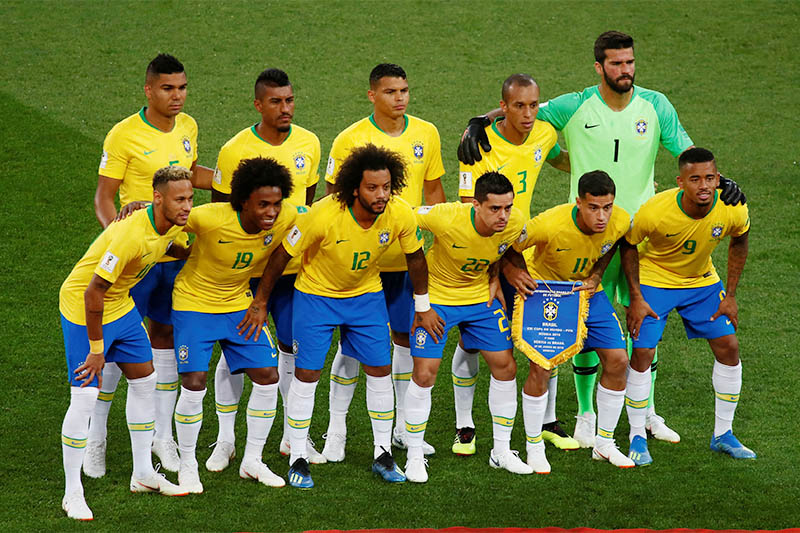 Brazil players pose for a team group photo before the match. Photo: Reuters
