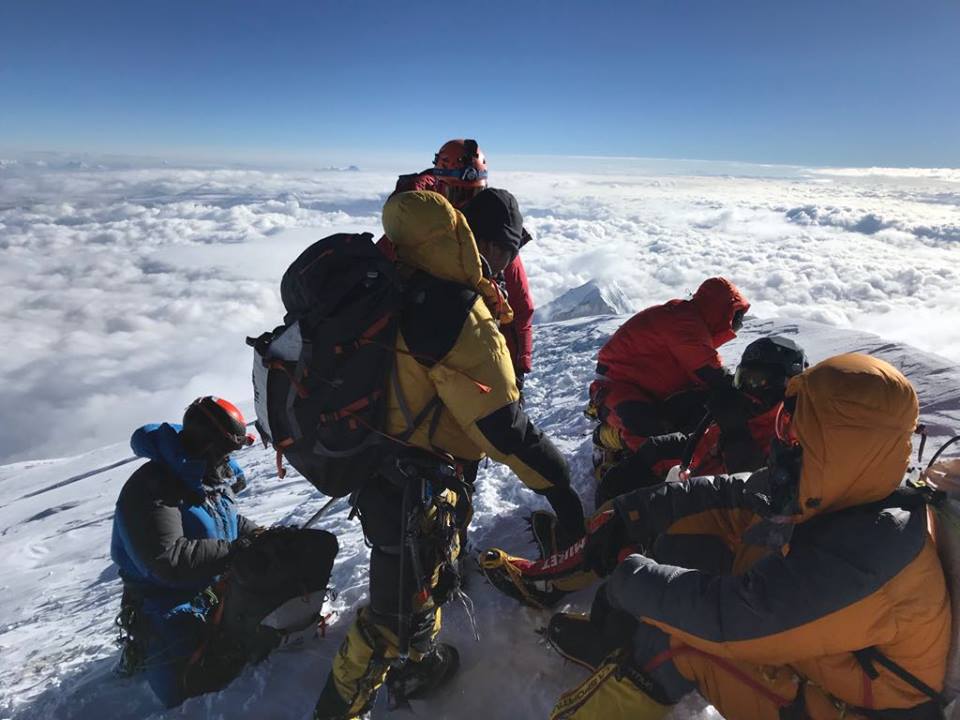 Climbers rest at the summit of K2, world's second highest mountain on July 22, 2018. Photo: Madison Mountaineering