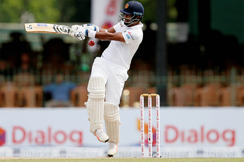 Sri Lanka's Dimuth Karunaratne hits a boundary. Photo: Reuters