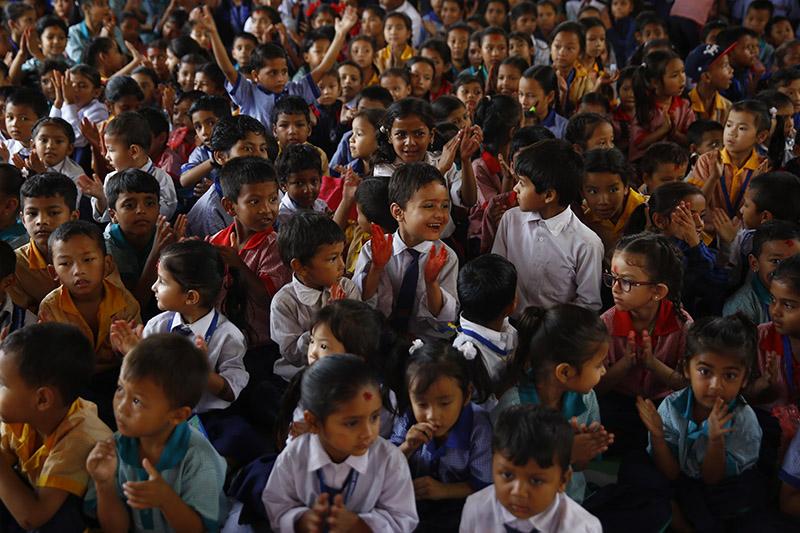 Nepali school children react during a cultural programme held to celebrate 'Guru Purnima' festival or Teacher's Day at a school, in Kathmandu, on Friday, July 27, 2018. Photo: Skanda Gautam/THT