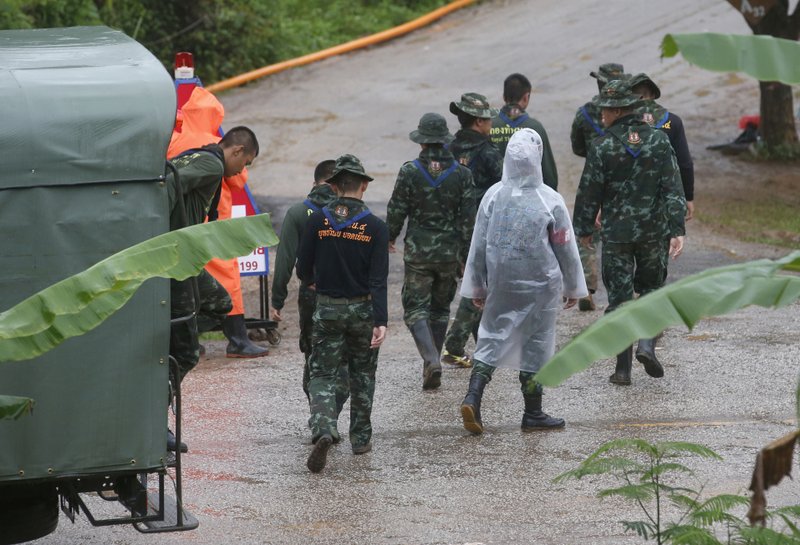 Rescuers move to the entrance to a cave complex where five stil lwere trapped in Mae Sai, Chiang Rai province, northern Thailand on Tuesday, July 10, 2018. Photo: AP