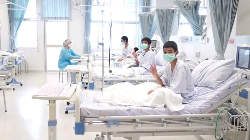 FILE PHOTO: A screen grab shows boys rescued from the Thai cave wearing mask and resting in a hospital in Chiang Rai, Thailand from a July 11, 2018 handout video. Photo: Reuters
