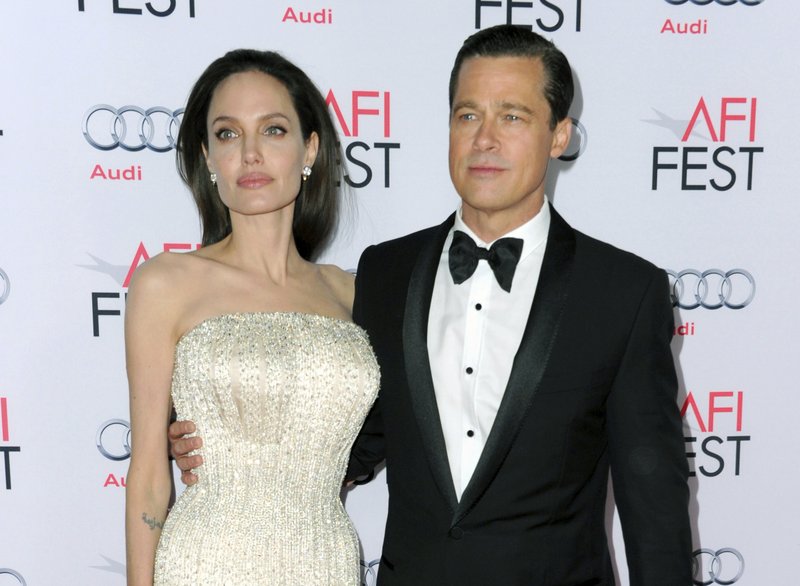 FILE - In this photo, Angelina Jolie, left, and Brad Pitt arrive at the 2015 AFI Fest opening night premiere of u201cBy The Seau201d in Los Angeles on Nov. 5, 2015. Photo: AP