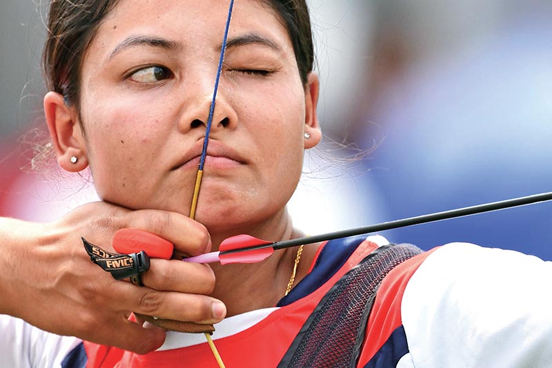 Nepalu2019s Gyanu Awale takes part in the ranking round of Recurve Womenu2019s Individual event of archery during the 18th Asian Games in Jakarta on Tuesday.