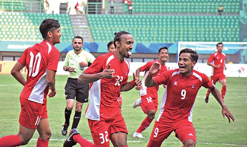 Nepalu2019s Rohit Chand and teammates celebrate an own goal from Pakistani player during their Asian Games match in Jakarta on Sunday.