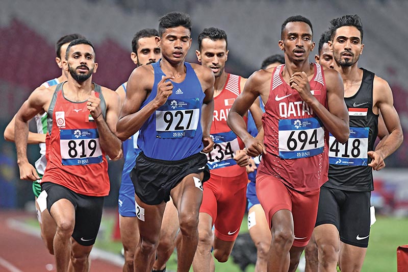 Nepalu2019s Som Bahadur Kumal (second from left) runs during the menu2019s 800m race