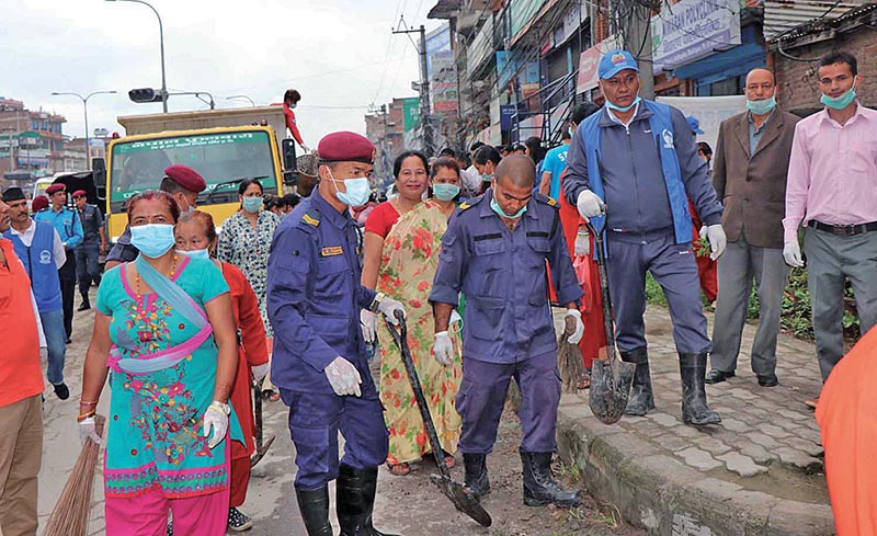 People participating in a cleaning campaign in MadhayapurThimi Municipality, on Saturday. Photo: RSS