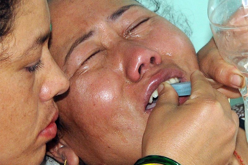 A woman trying to comfort Chameli Khadka, the mother of Nishan Khadka, who was killed by his abductors, in Bhaktapur, on Monday, August 6, 2018. Photo: Balkrishna Thapa Chhetri/THT