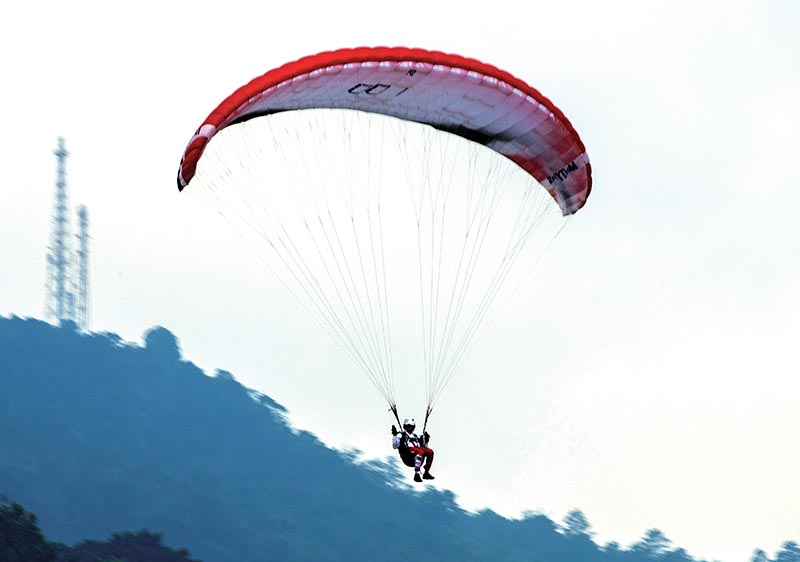 Bijay Gautam in action during the menu2019s Team Accuracy event of paragliding during the 2018 Asian Games in West Java, Indonesia, on August 20, 2018. Photo: Reuters