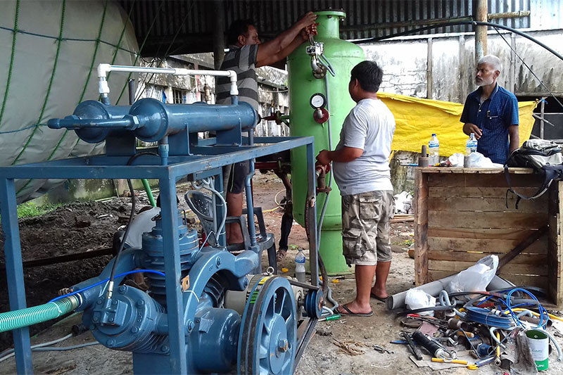 Technicians work at the biogas plant at Shri Krishna Gaushala in Biratnagar. The plant started distributing biogas to 32 households on Thursday. Photo: Hari Adhikari/THT 