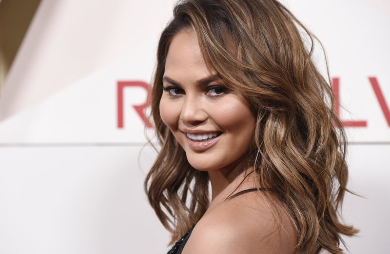 File - In this photo, model Chrissy Teigen poses at the 2017 Revolve Awards at the Dream Hollywood hotel in Los Angeles on Nov. 2, 2017.