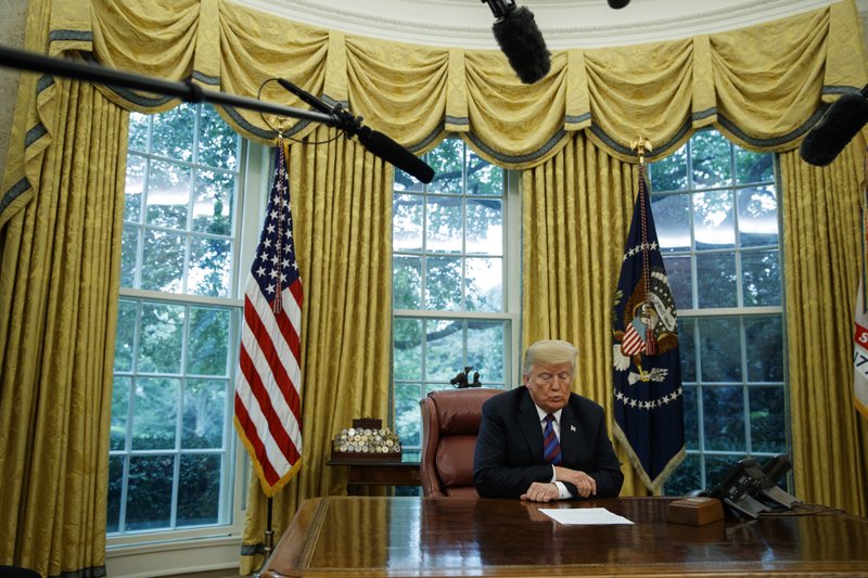 President Donald Trump listens during a phone call with Mexican President Enrique Pena Nieto about a trade agreement between the United States and Mexico, in the Oval Office of the White House, on Monday, Aug. 27, 2018, in Washington. Photo: AP