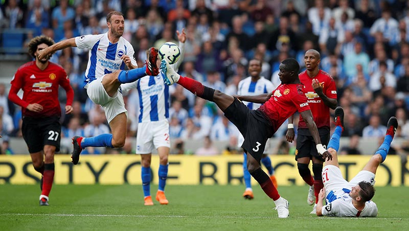 Brighton's Glenn Murray in action with Manchester United's Eric Bailly during the Premier League match between Brighton &amp; Hove Albion and Manchester United, at The American Express Community Stadium, in Brighton, Britain, on August 19, 2018. Photo: Reuters