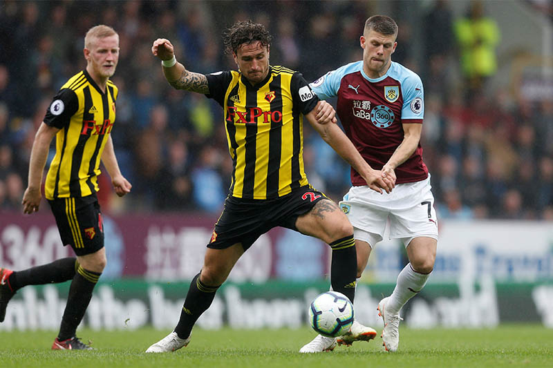 Watford's Daryl Janmaat in action with Burnley's Johann Berg Gudmundsson. Photo: Reuters