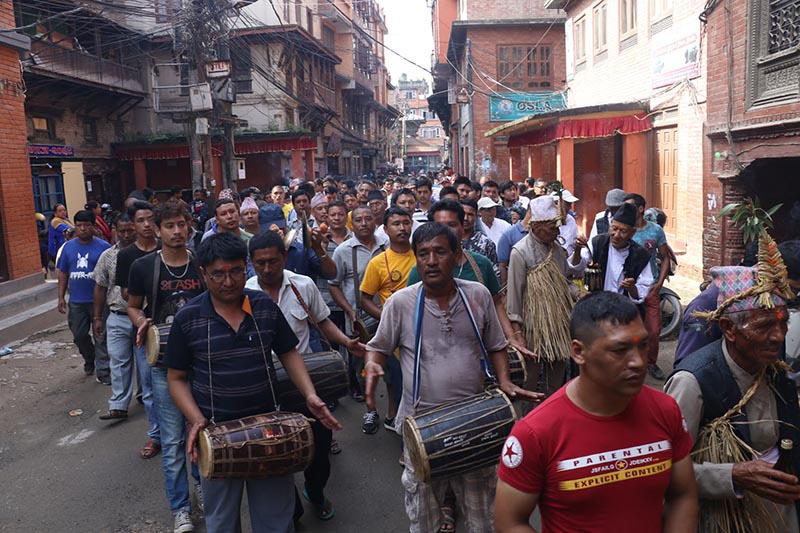 Locals play 'Mridanga', a traditional musical instrument while marching in procession to mark Gaijatra festival, in Madhyapur Thimi, Bhaktapur, on Monday, August 27, 2018. Photo: RSS