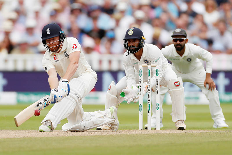 England's Jonny Bairstow in action as India's Dinesh Karthik looks on. Photo: Reuters